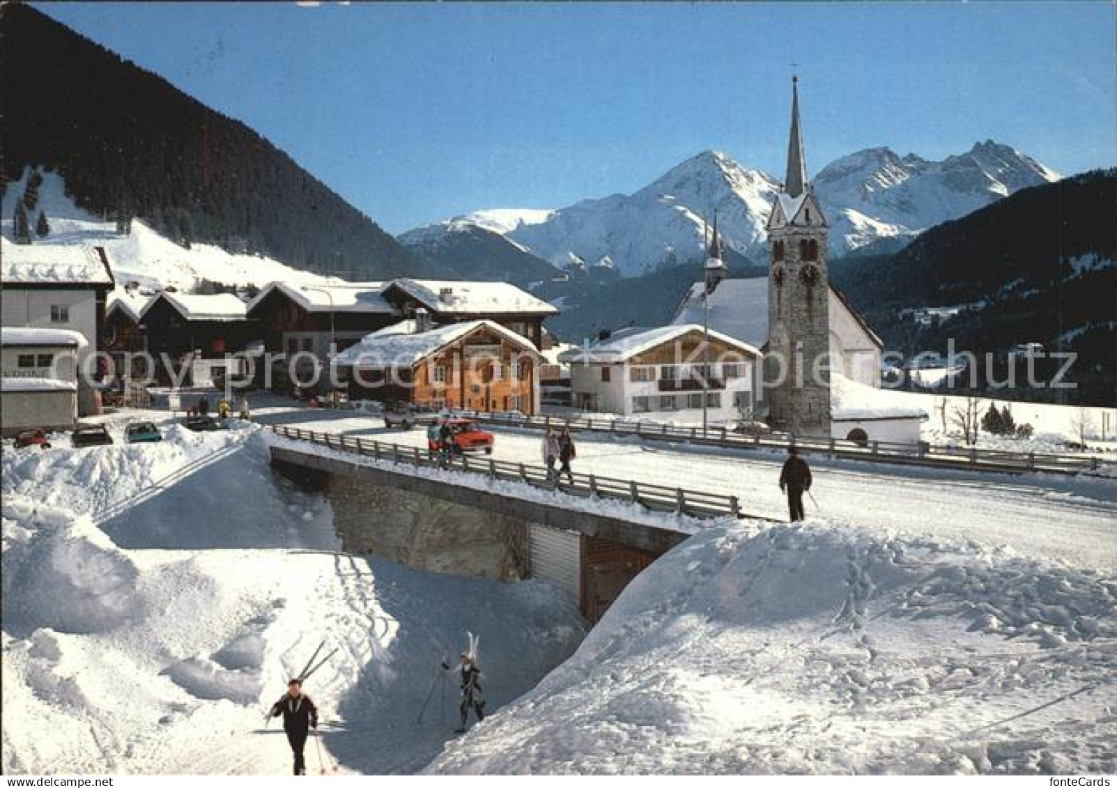 12459711 Sedrun Tujetsch Ortsansicht Kirche Winter