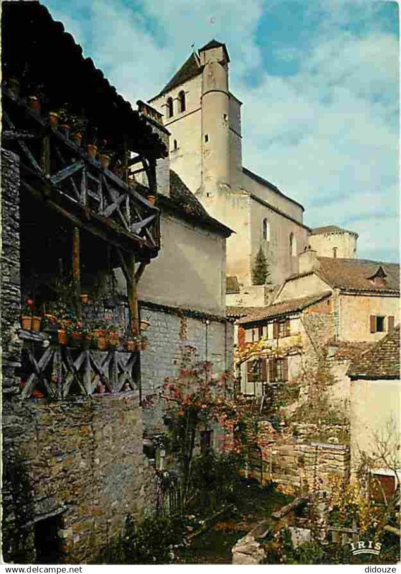 46 - Saint Cirq Lapopie - Vieilles Maisons Quercynoises et l'Eglise - CPM - Voir Scans Recto-Verso