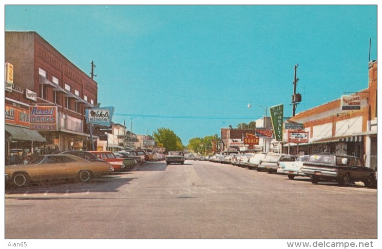 Branson Missouri, Commericial Street, Autos,, Rexall Drug Store, Realty, Business Signs, c1960s Vintage Postcard