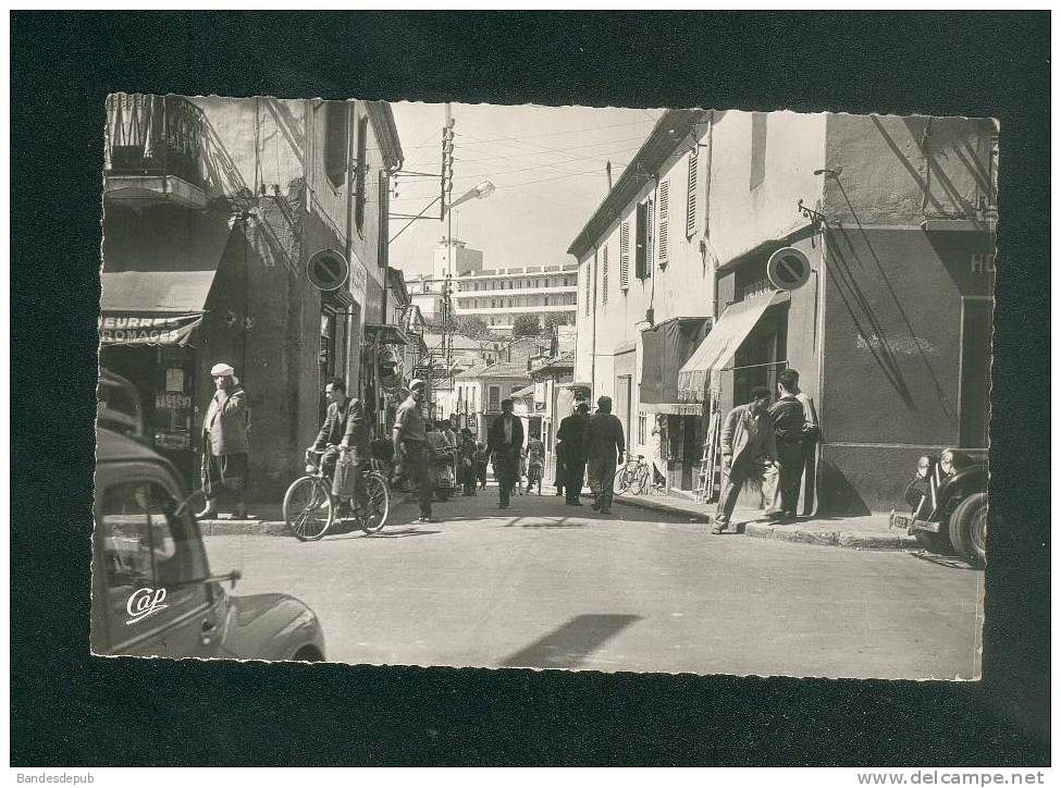 CPSM - Algerie - Médéa - Rue Urbain Grandier ( animée commerce automobile CAP 1529 format CPA)