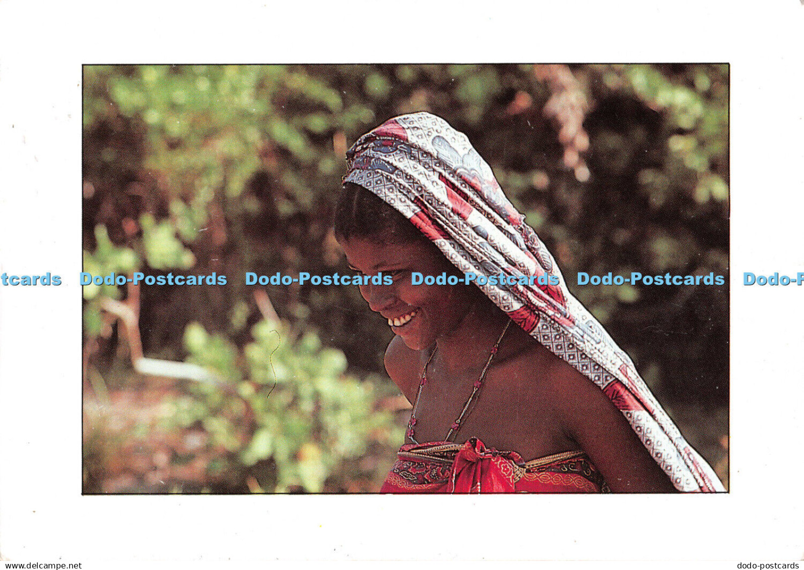 D100456 A Tanzania lady in a colourful kitenge dress. Graphi S. A. Tanzania Tour