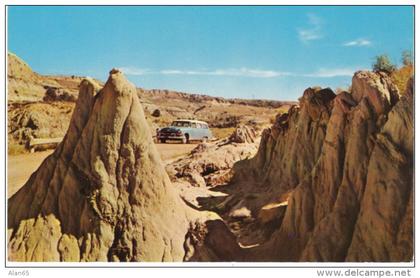 Badlands SD South Dakota, Auto in Barren Terrain c1950s Vintage Postcard