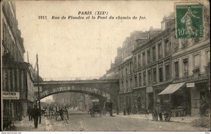 75 - PARIS - arrondissement 19 - rue de Flandre et pont du chemin de fer