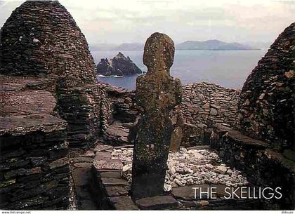 Irlande - Kerry - Against a backdrop of the South Kerry coastline the oratories beehive dwellings and monuments of Skell