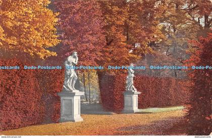 R358025 Autumn Garden Two statues 1904