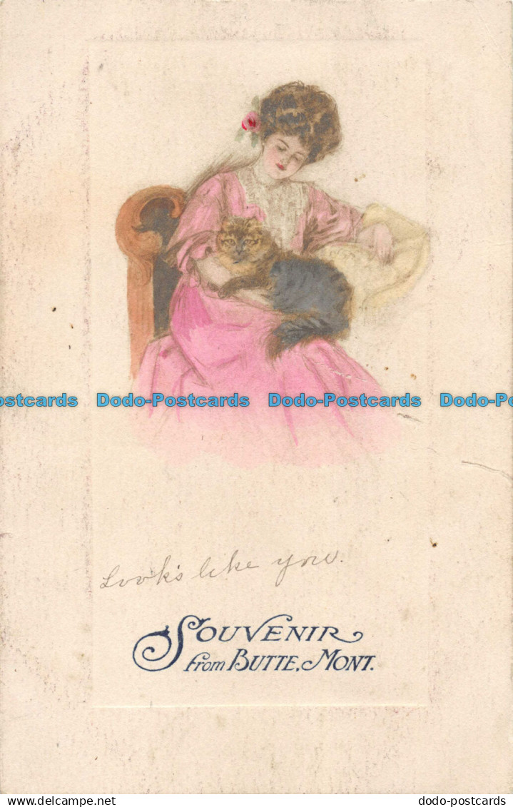 R161786 Souvenir from Butte Mont. Woman with Cat