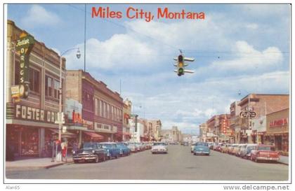 Miles City MT Montana, Main Street Chrome Street Scene, Autos, Drug Store, Cafe, Mail Box, 1950s Vintage Postcard