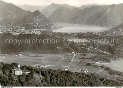 13795165 Agno Lago di Lugano TI Fliegeraufnahme Blick v. Santa Maria auf Agno -