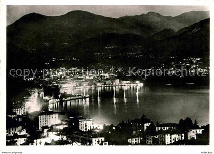 12819086 Lugano Lago di Lugano di notte Nachtaufnahme Lugano Lago di Lugano