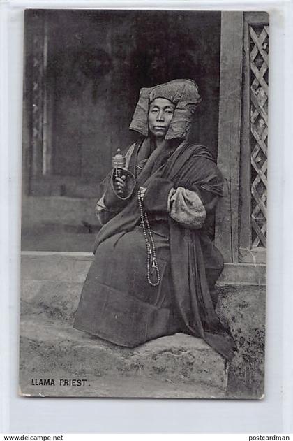 Tibet - Lama priest with prayer wheel