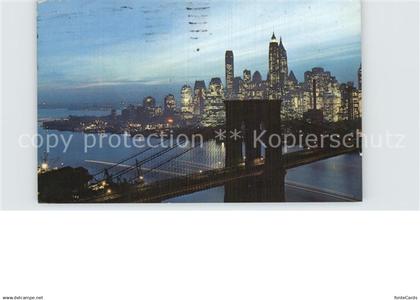 72580746 Manhattan New York Nightfall in Lower Manhattan with Brooklyn Bridge