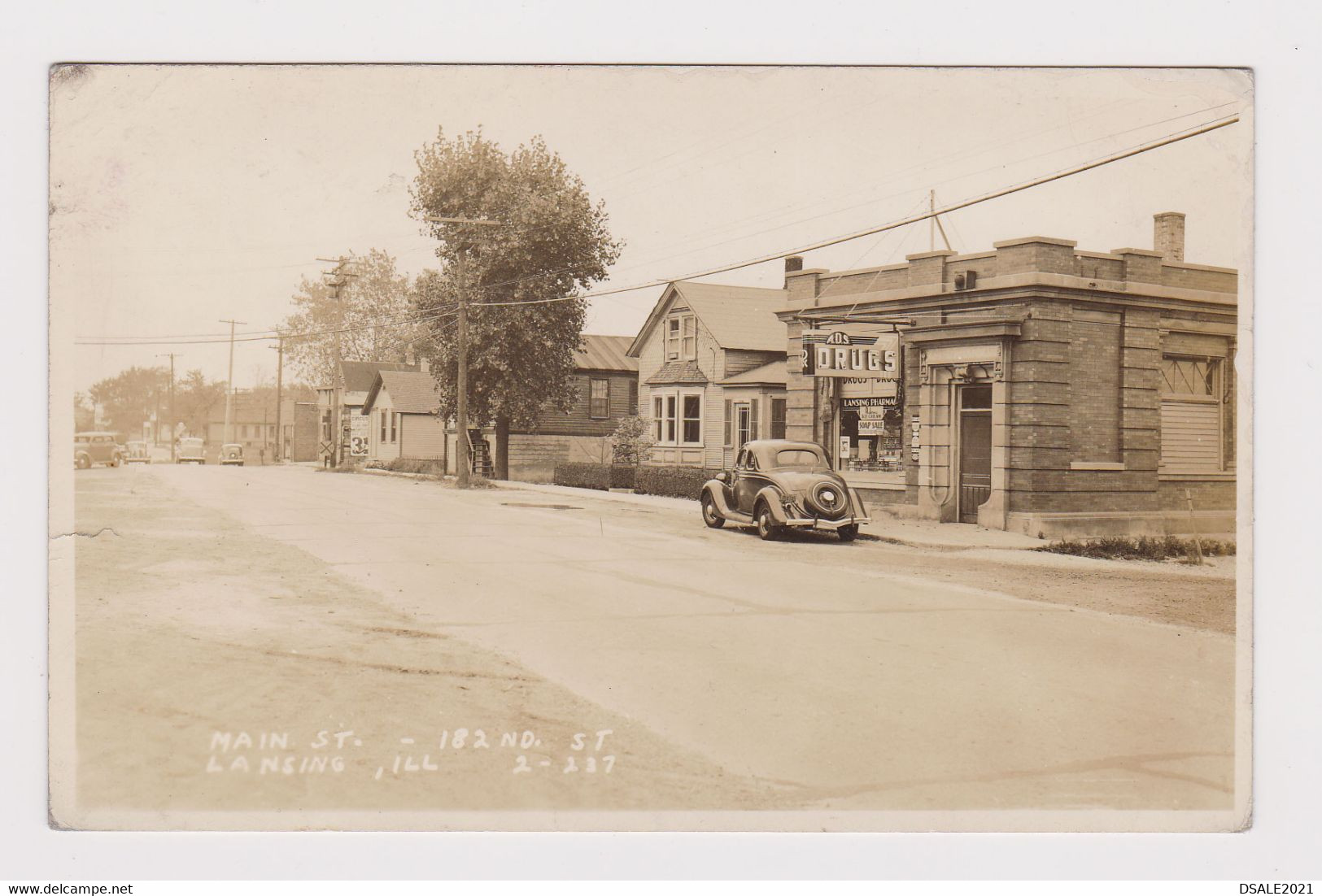 USA United States LANSING ILL Drug Store View Main St. with Old Car Vintage Photo Portrard RPPc (51775)