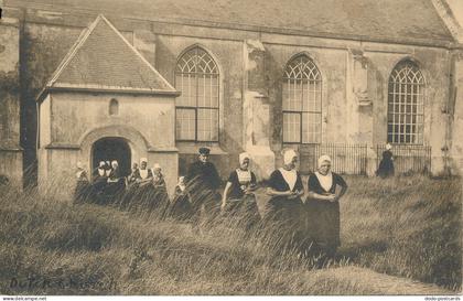 PC43818 Kerkuitgang Zoutelande. Zeeland. F. B. den Boer. 1910. B. Hopkins