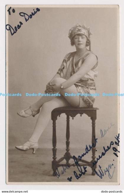 C025002 Woman is sitting on a chair. Stoke on Trent. Burton. Worchester. 1924