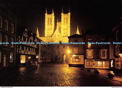 D106934 Lincoln Minster. Floodlit from Exchequergate. Lincoln Minster Shop. Judg