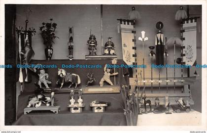 R133842 Old Postcard. Toys and Statues at the Room