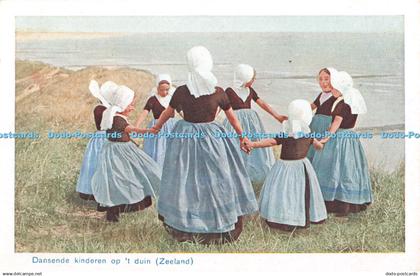 R346511 Zeeland Dansende kinderen op t duin Postcard