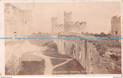 R479180 Conway Castle Courtyard T R Hammond 1910