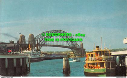 R533517 City of Sydney. Sydney Harbour Bridge from Circular Quay with one of man